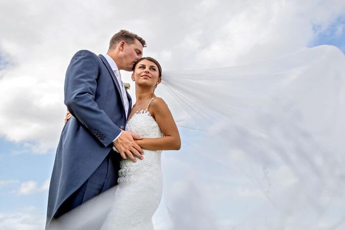 Wedding couple again cloudy sky