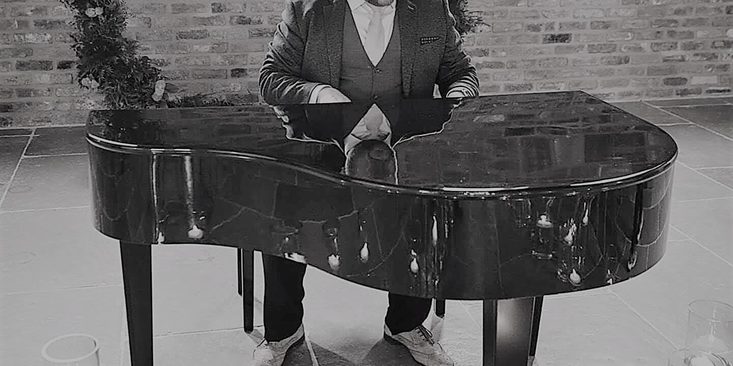 male playing piano