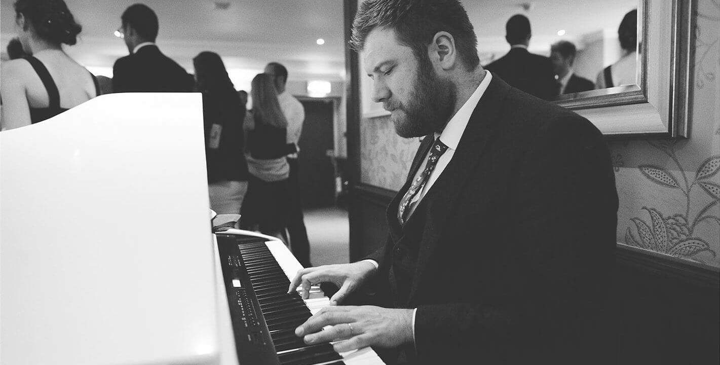 male playing piano