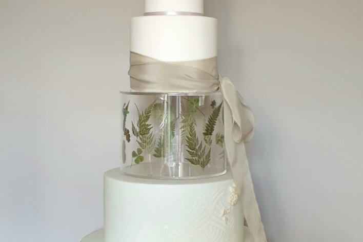 Tiered wedding cake with ribbon